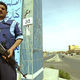 Hassim waves several Total Islamic War coworkers through a checkpoint.